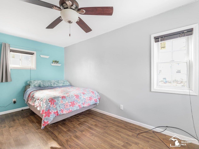 bedroom featuring dark hardwood / wood-style floors and ceiling fan