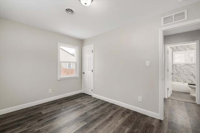 unfurnished room with dark hardwood / wood-style floors