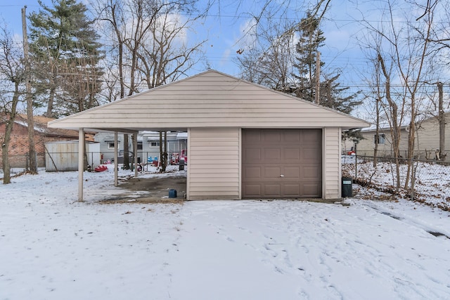 view of snow covered garage