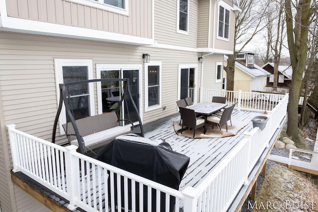 wooden terrace featuring area for grilling