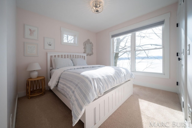 bedroom with light colored carpet