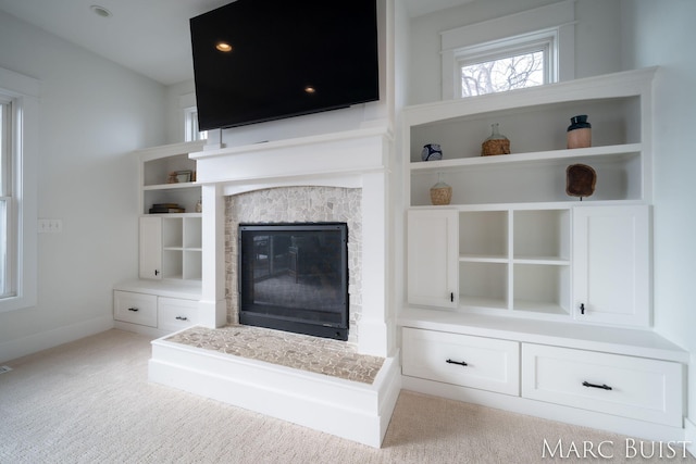 unfurnished living room featuring light colored carpet