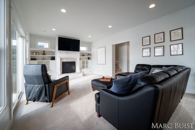 living room with light carpet and a wealth of natural light