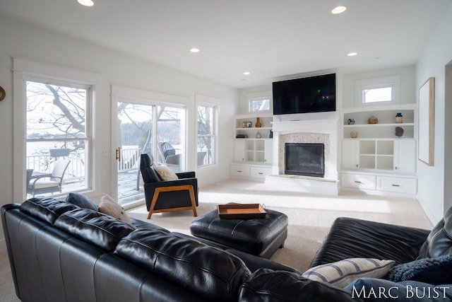 living room with carpet floors and built in shelves