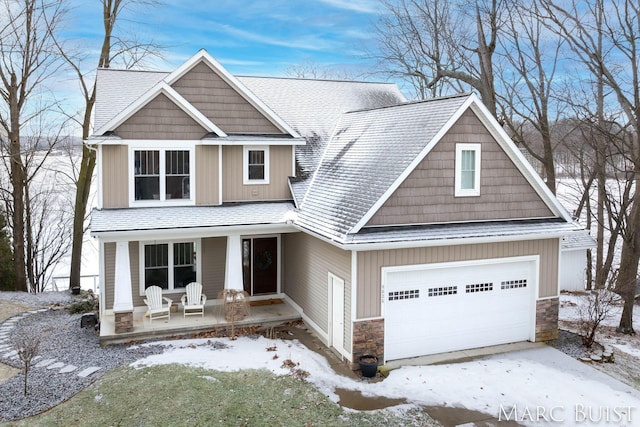 craftsman-style home featuring a garage and covered porch