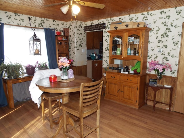 dining space with wood ceiling, ceiling fan, and light wood-type flooring