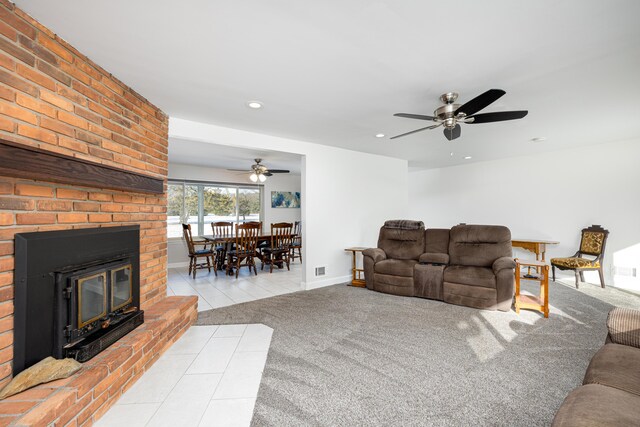 7500 Dexter Pinckney Rd, Dexter, MI 48130 - living room featuring light colored carpet, a fireplace, and ceiling fan