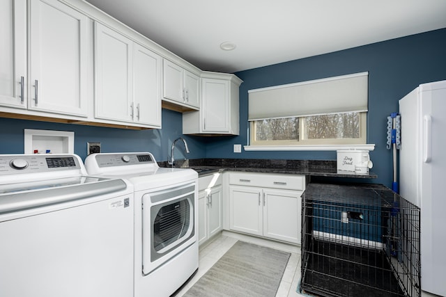 7500 Dexter Pinckney Rd, Dexter, MI 48130 - washroom featuring cabinets, light tile patterned flooring, sink, and independent washer and dryer