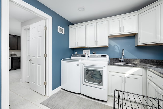 7500 Dexter Pinckney Rd, Dexter, MI 48130 - washroom with cabinets, sink, washing machine and dryer, and light tile patterned floors