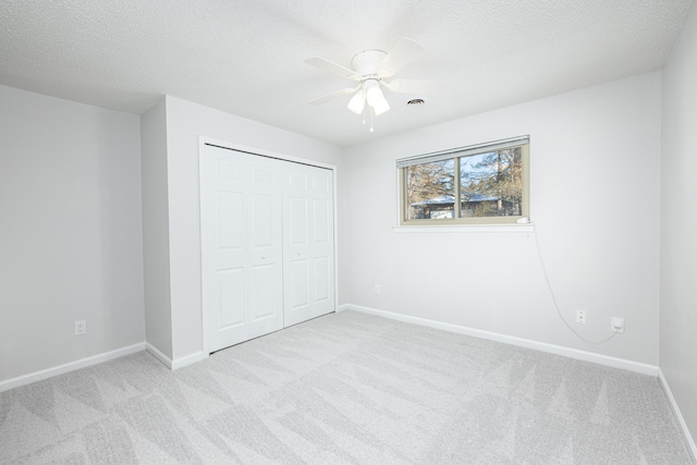 7500 Dexter Pinckney Rd, Dexter, MI 48130 - unfurnished bedroom featuring light carpet, a closet, and a textured ceiling