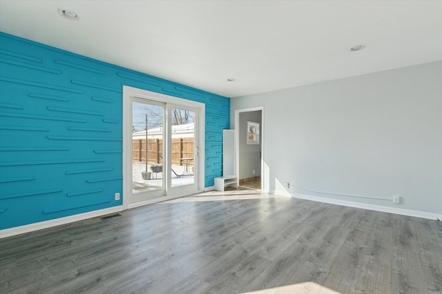 spare room featuring hardwood / wood-style floors