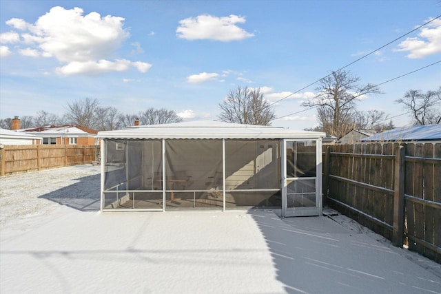 exterior space featuring a sunroom