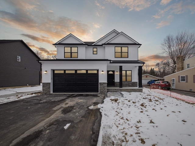 modern inspired farmhouse featuring a garage