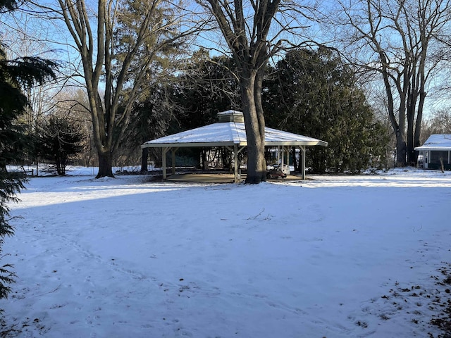 view of yard layered in snow