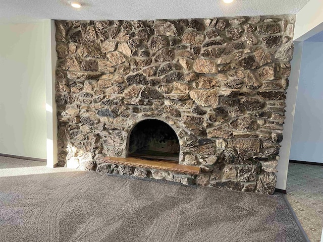 details featuring a fireplace and carpet flooring