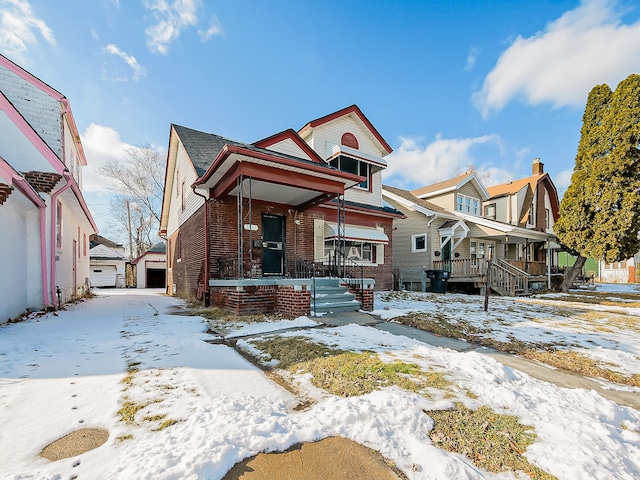 view of front of property featuring a porch and a garage