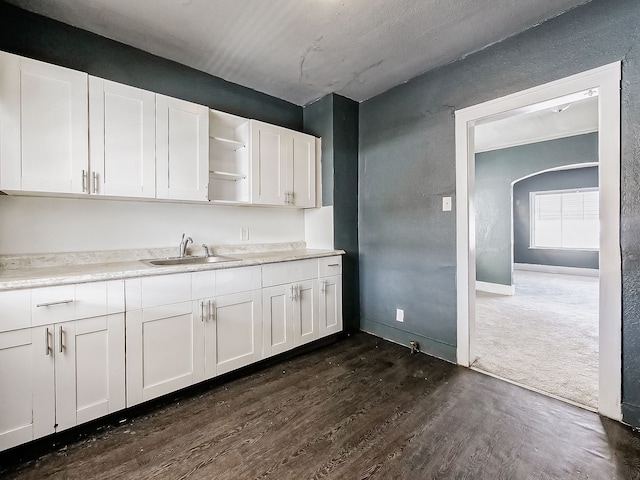 kitchen featuring sink, white cabinets, and dark hardwood / wood-style flooring