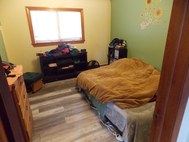 bedroom featuring wood finished floors