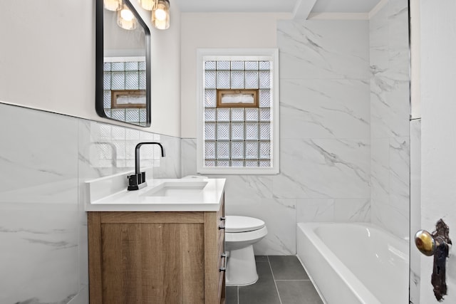 bathroom with vanity, tile walls, and toilet