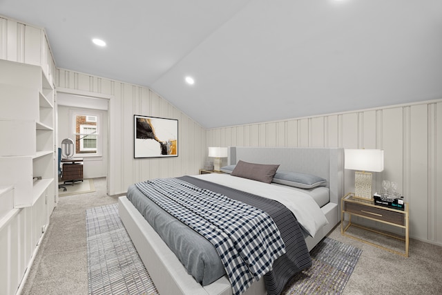 carpeted bedroom featuring vaulted ceiling