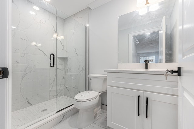 bathroom featuring vanity, toilet, and an enclosed shower