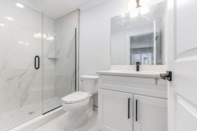 bathroom with vanity, toilet, and a shower with shower door