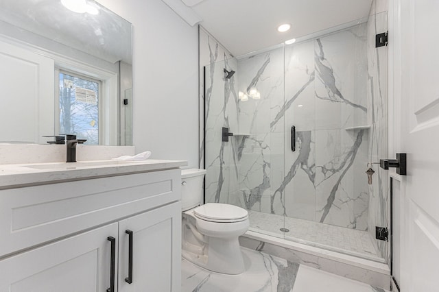 bathroom with vanity, an enclosed shower, and toilet