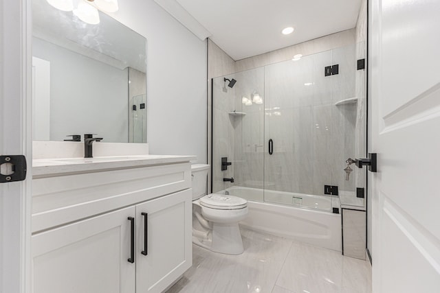 full bathroom with vanity, combined bath / shower with glass door, and toilet