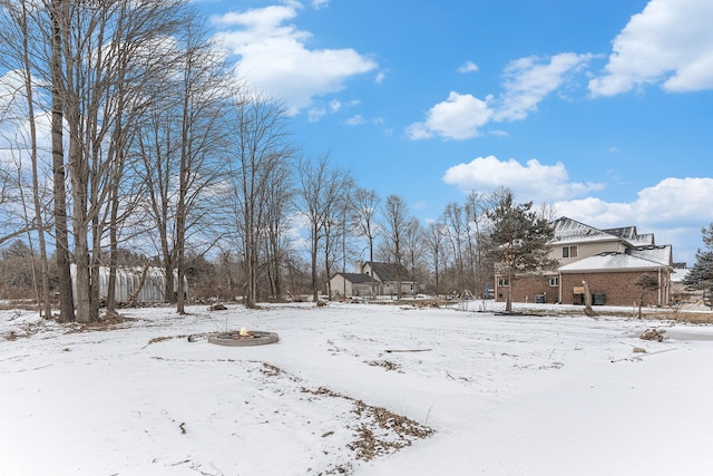 view of yard layered in snow