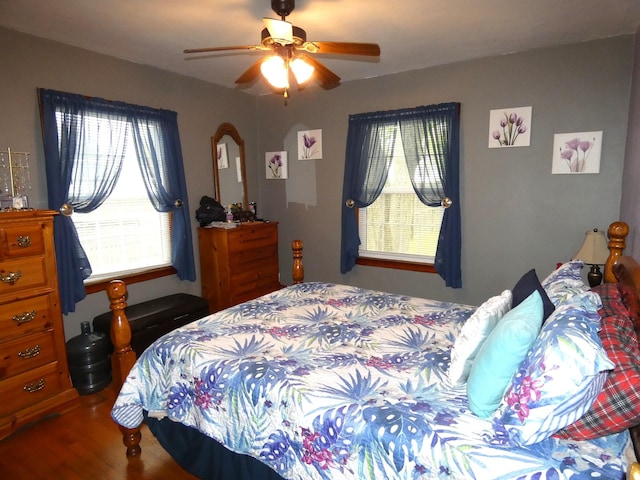 bedroom with a ceiling fan and wood finished floors