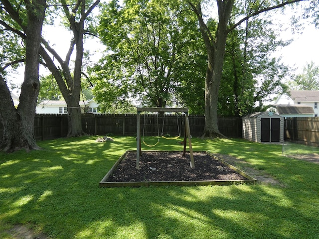 6 Poplar St, Three Oaks, MI 49128 - fenced backyard featuring a storage shed and a playground