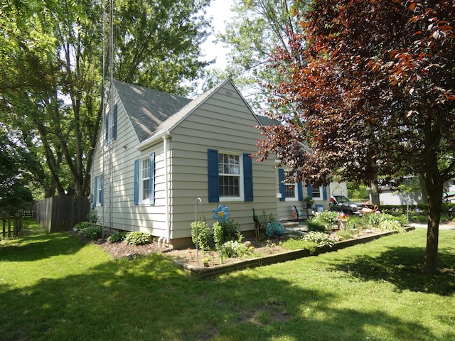 6 Poplar St, Three Oaks, MI 49128 - view of property exterior featuring a shingled roof