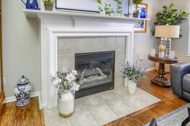 interior details with a tile fireplace