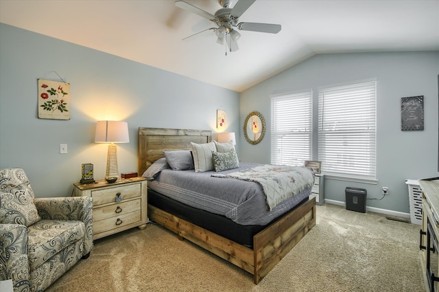 bedroom with ceiling fan, lofted ceiling, and carpet flooring