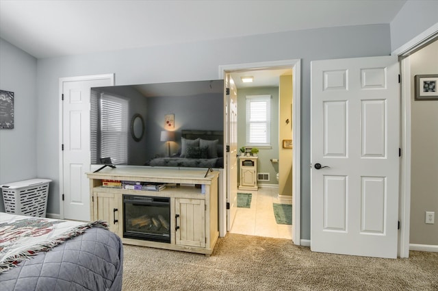 bedroom featuring light colored carpet