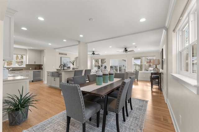 dining space featuring light wood-type flooring