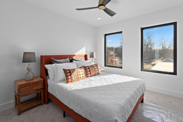 carpeted bedroom featuring ceiling fan