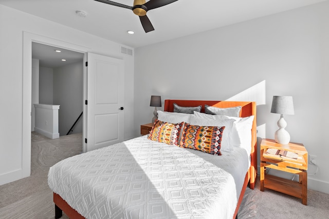 bedroom featuring light carpet and ceiling fan