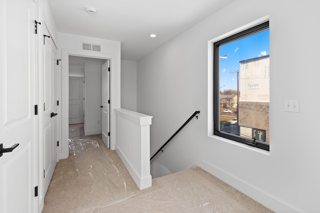 hallway featuring a barn door