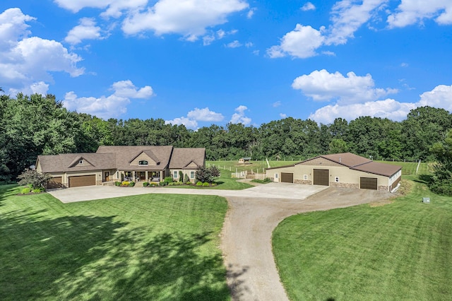 view of front of house with driveway and a front yard