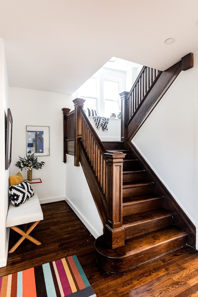 stairs with wood-type flooring