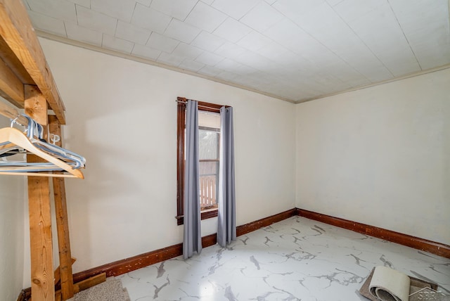 unfurnished room featuring crown molding