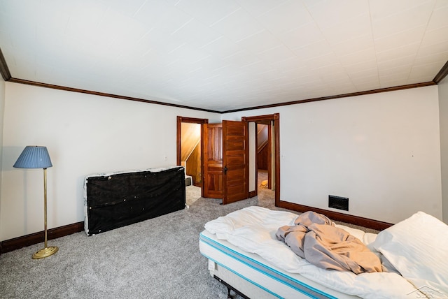 bedroom with carpet floors and ornamental molding