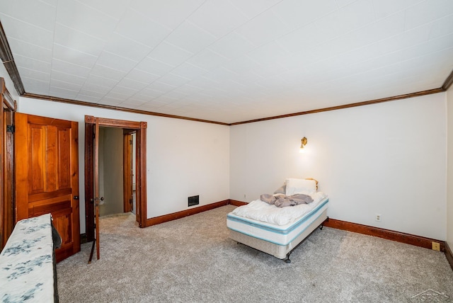 carpeted bedroom with ornamental molding