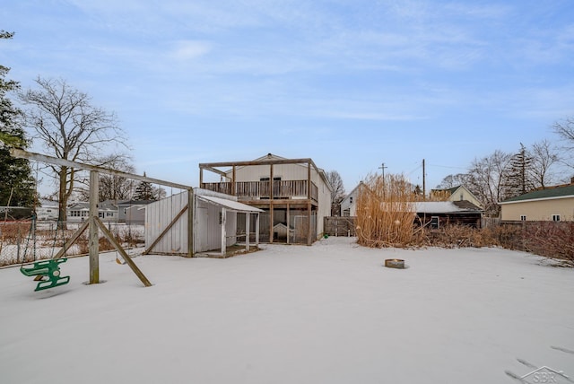 snow covered property featuring a deck