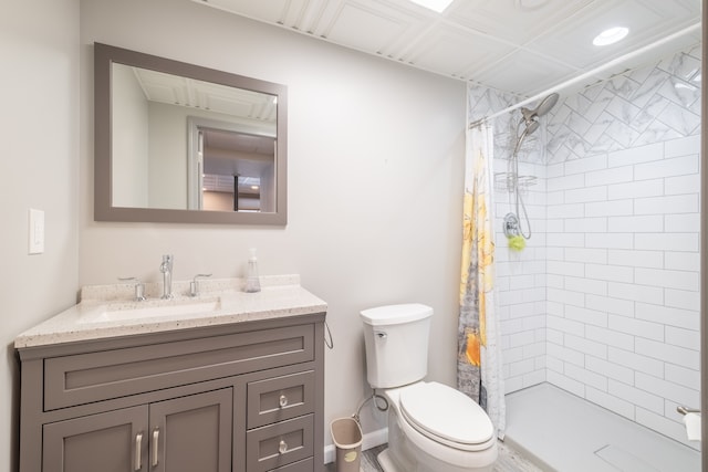 bathroom with vanity, toilet, and walk in shower