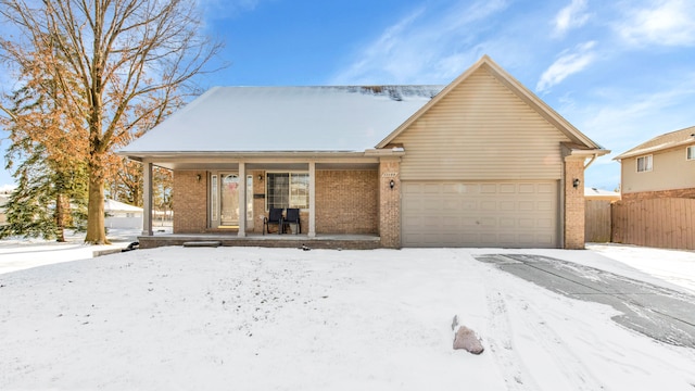 view of front of home with a garage and covered porch