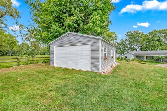 garage featuring a yard