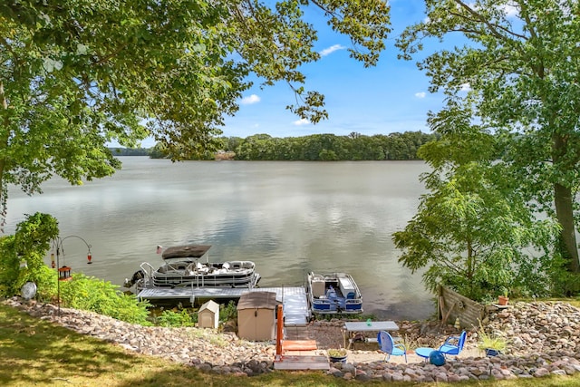 property view of water with a dock