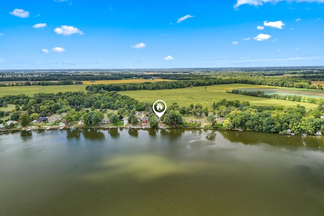 birds eye view of property featuring a water view and a rural view